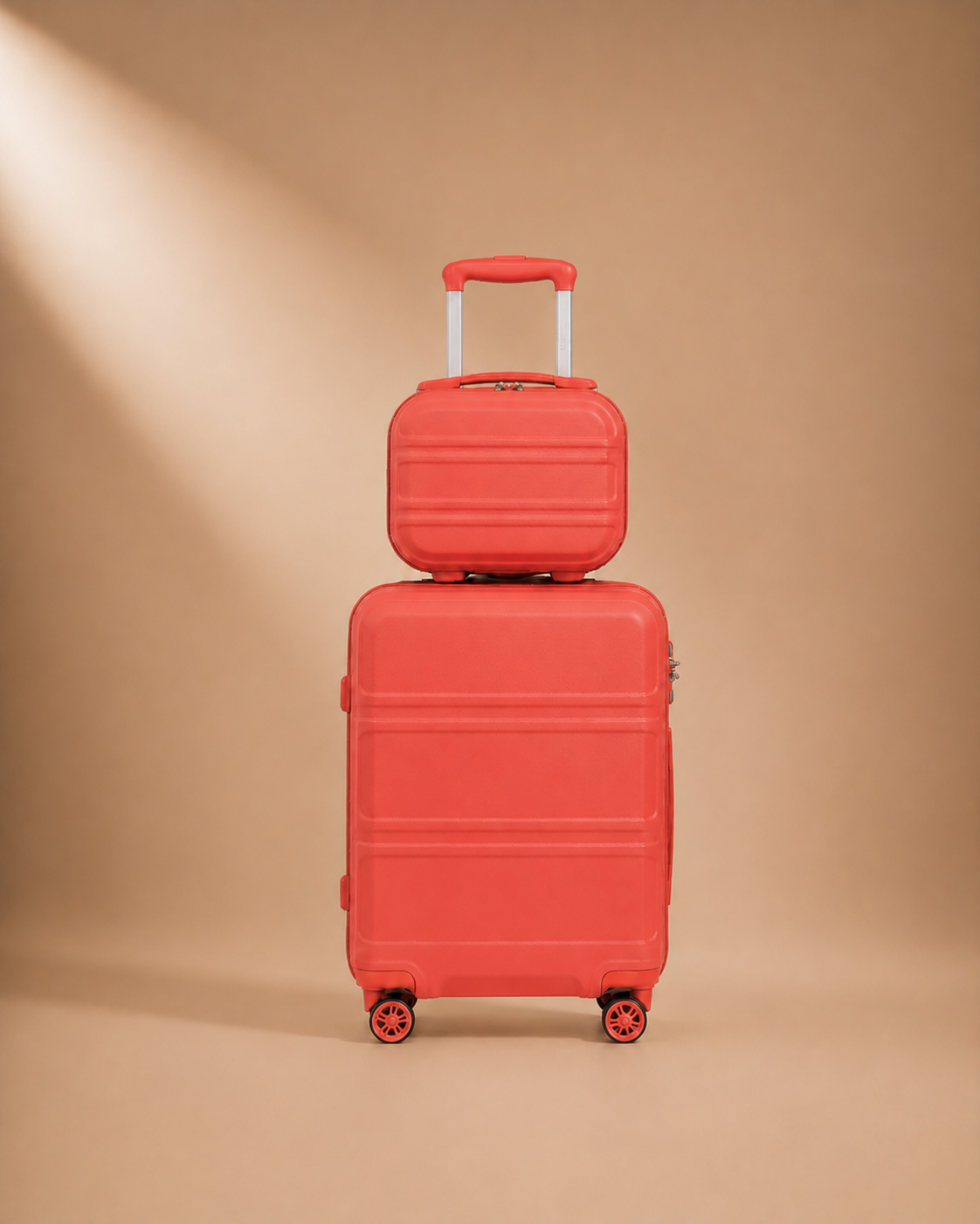 Tenby coral two-piece suitcase set — premium studio product view