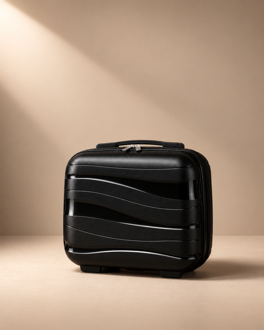 Housel black 14 inch hard shell travel makeup case with wave design in a premium studio product photo.