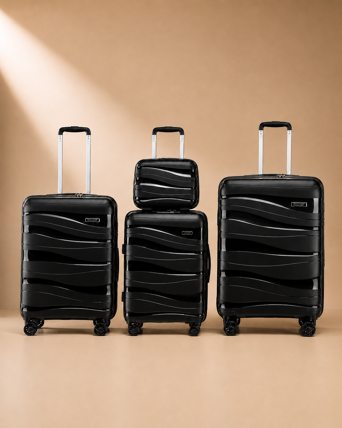 Rhosneigr 4 Piece Hard Shell Suitcase Set - Black colour variant. Premium studio product photography with clean continuous background and polished hard shell suitcase finish.