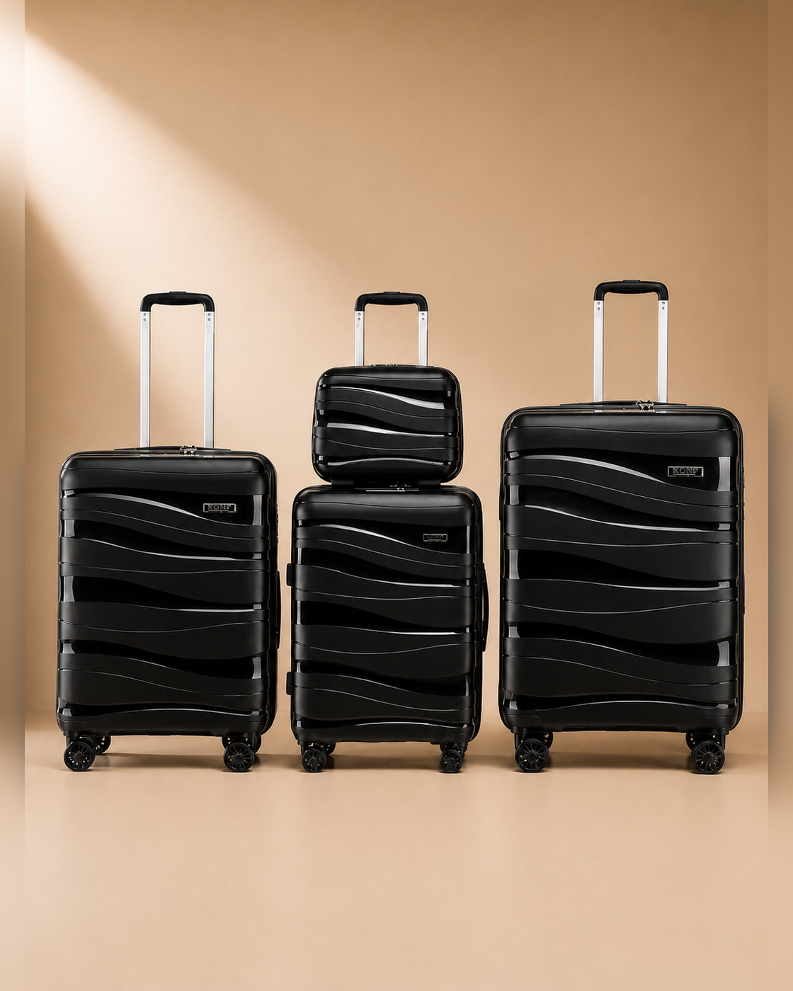 Rhosneigr 4 Piece Hard Shell Suitcase Set - Black colour variant. Clean premium studio product photography with smooth background and polished hard shell suitcase finish.