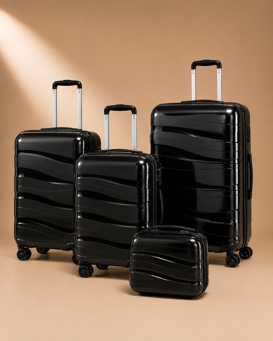 Rhosneigr 4 Piece Hard Shell Suitcase Set - black set view 1. Clean premium studio product photography with smooth background and polished hard shell suitcase finish.