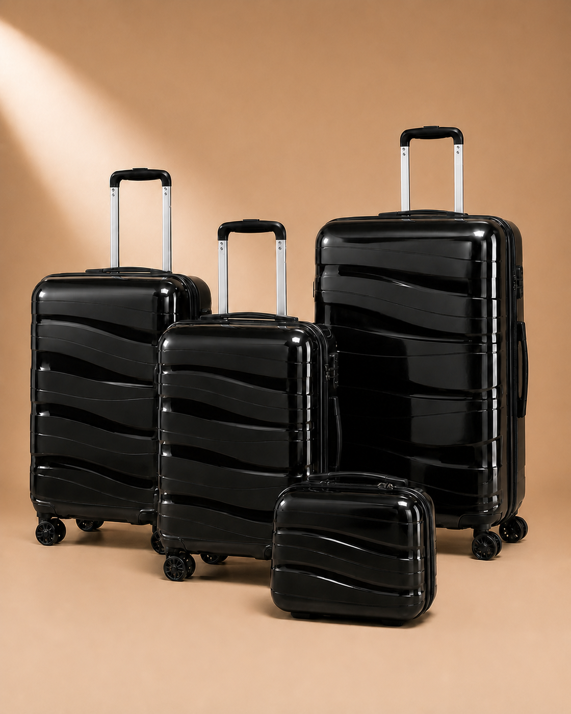 Rhosneigr 4 Piece Hard Shell Suitcase Set - black set view 1. Premium studio product photography with clean continuous background and polished hard shell suitcase finish.