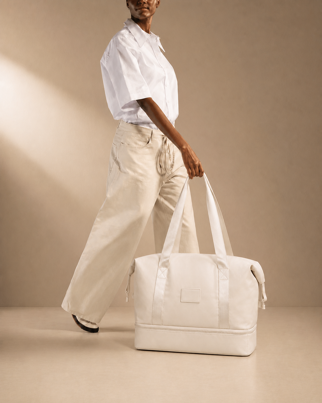 Coniston large capacity expandable travel bag in white, lifestyle studio view