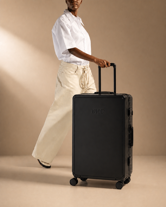 Mevagissey aluminium frame cabin suitcase in a premium travel lifestyle studio scene