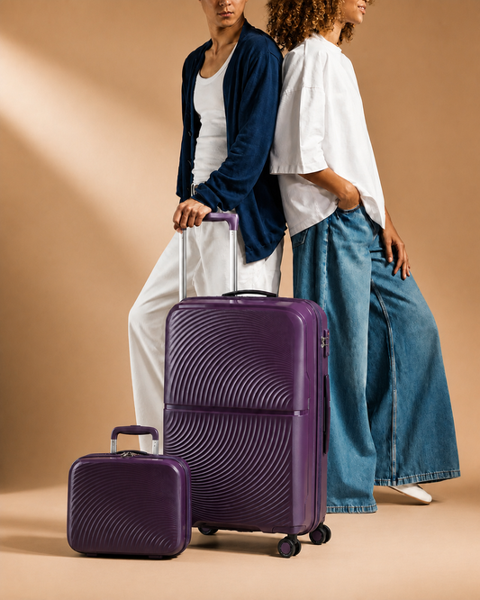 Solva 2 Piece Hard Shell Suitcase Set in purple with lifestyle studio styling
