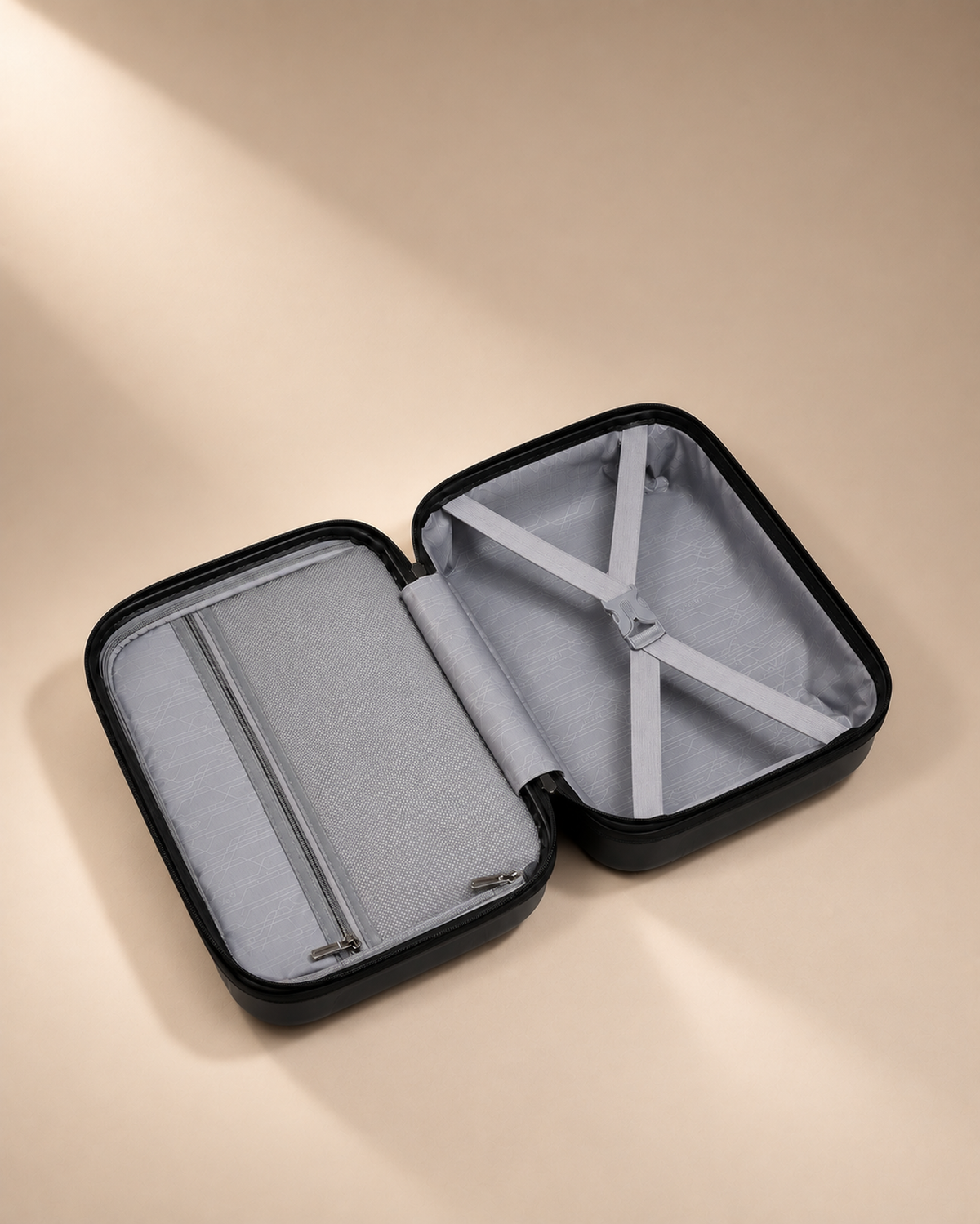 Housel black travel makeup case open to show grey interior lining, straps and organiser pocket for travel essentials.