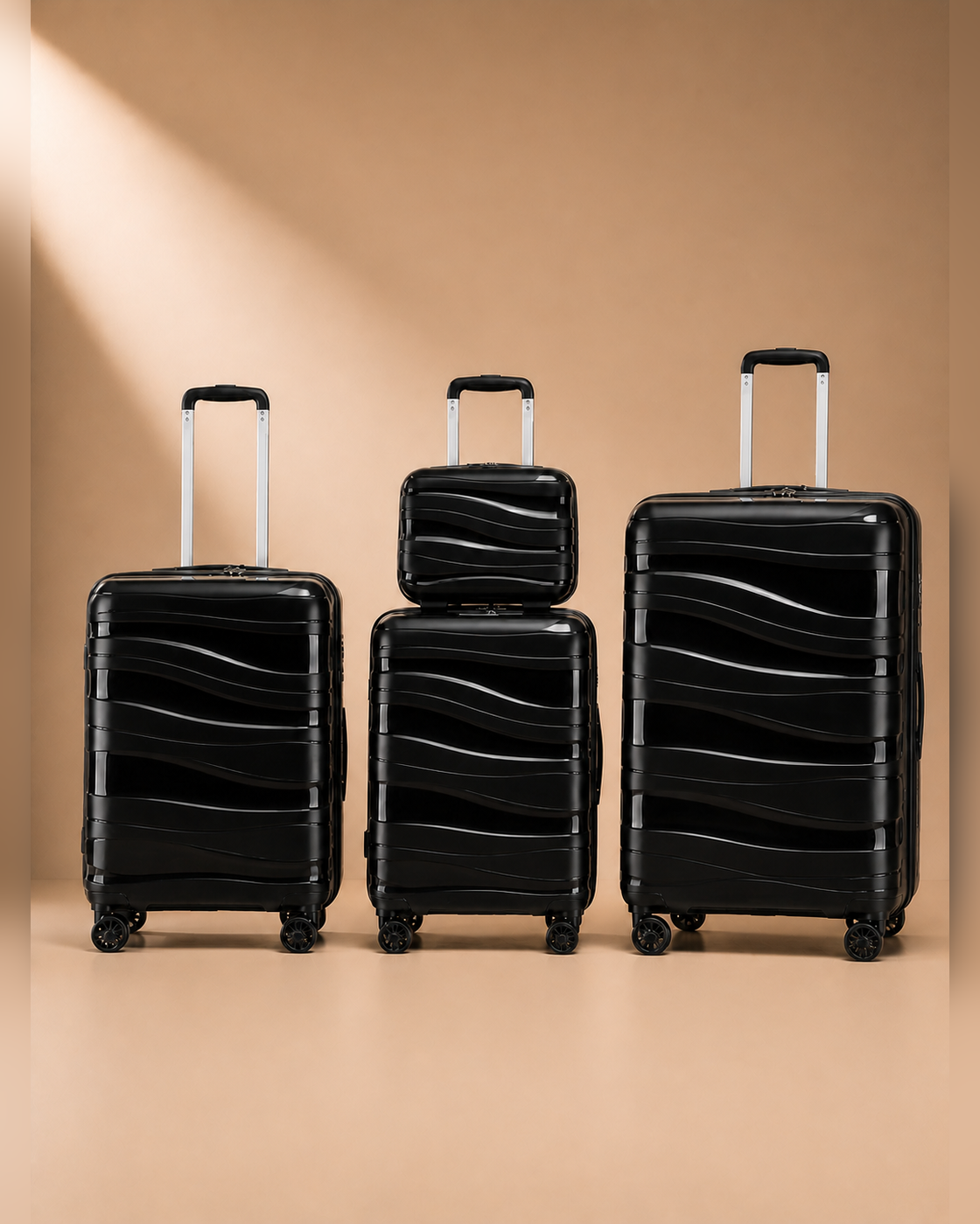 Rhosneigr 4 Piece Hard Shell Suitcase Set - black set view 3. Clean premium studio product photography with smooth background and polished hard shell suitcase finish.