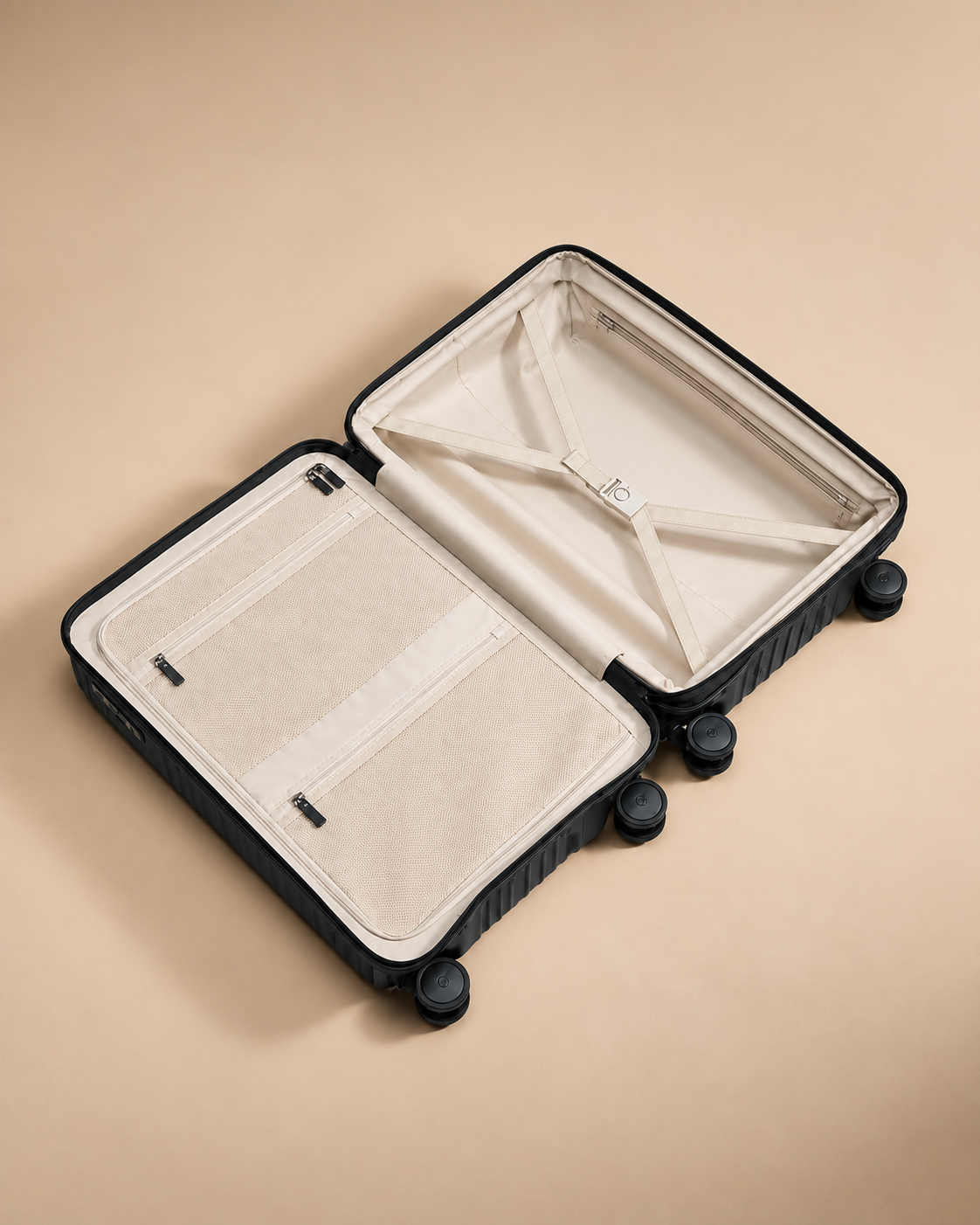 Tresaith hard shell suitcase open interior with cream lining, mesh pockets and cross straps for organised packing
