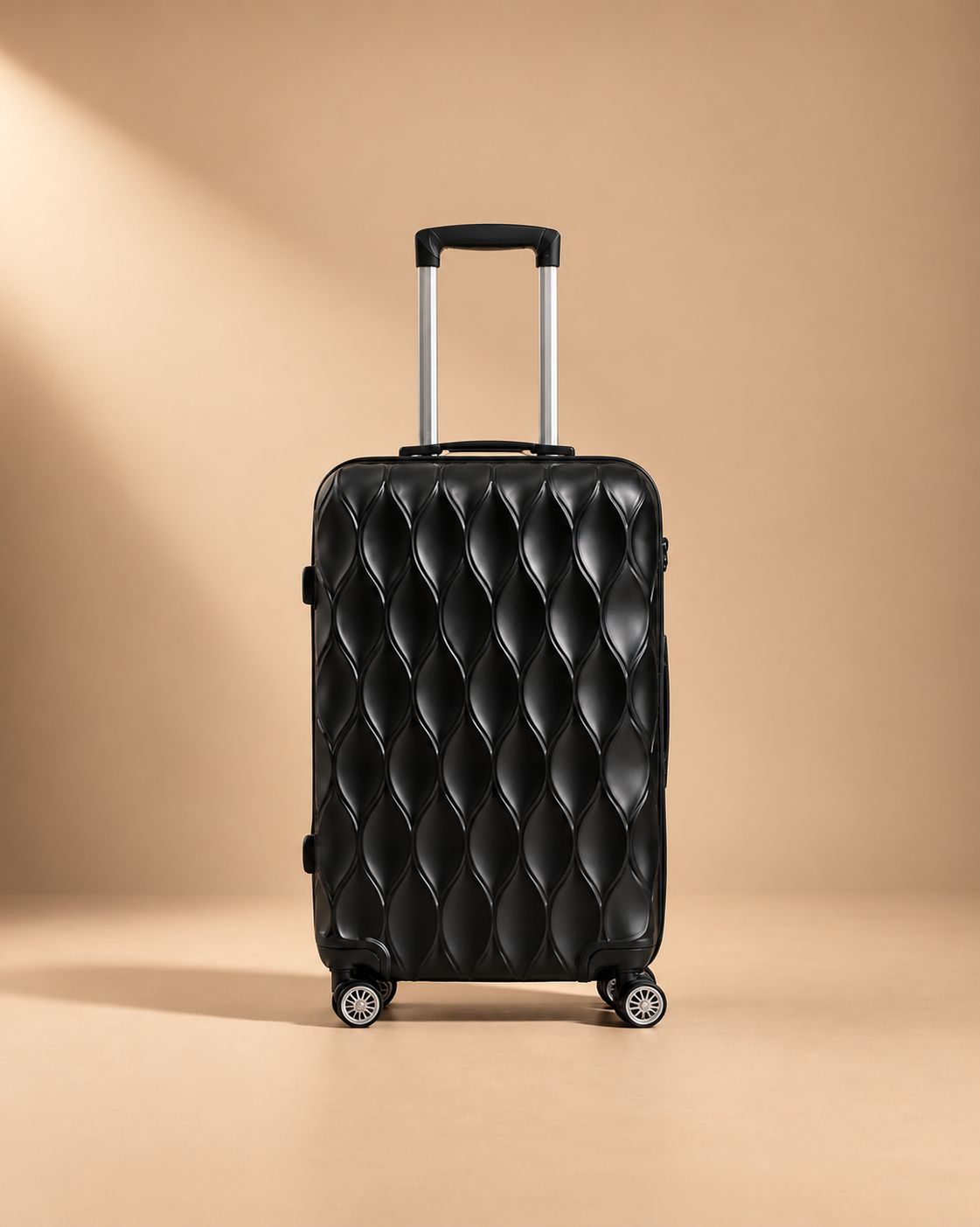 Anstruther black hard shell carry-on suitcase with glossy quilted finish, telescopic handle and spinner wheels