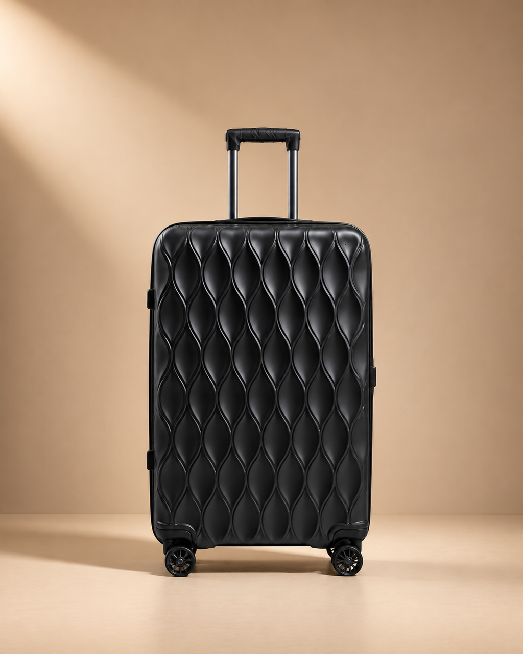 Anstruther black upright suitcase with quilted hard shell, smooth spinner wheels and premium travel design