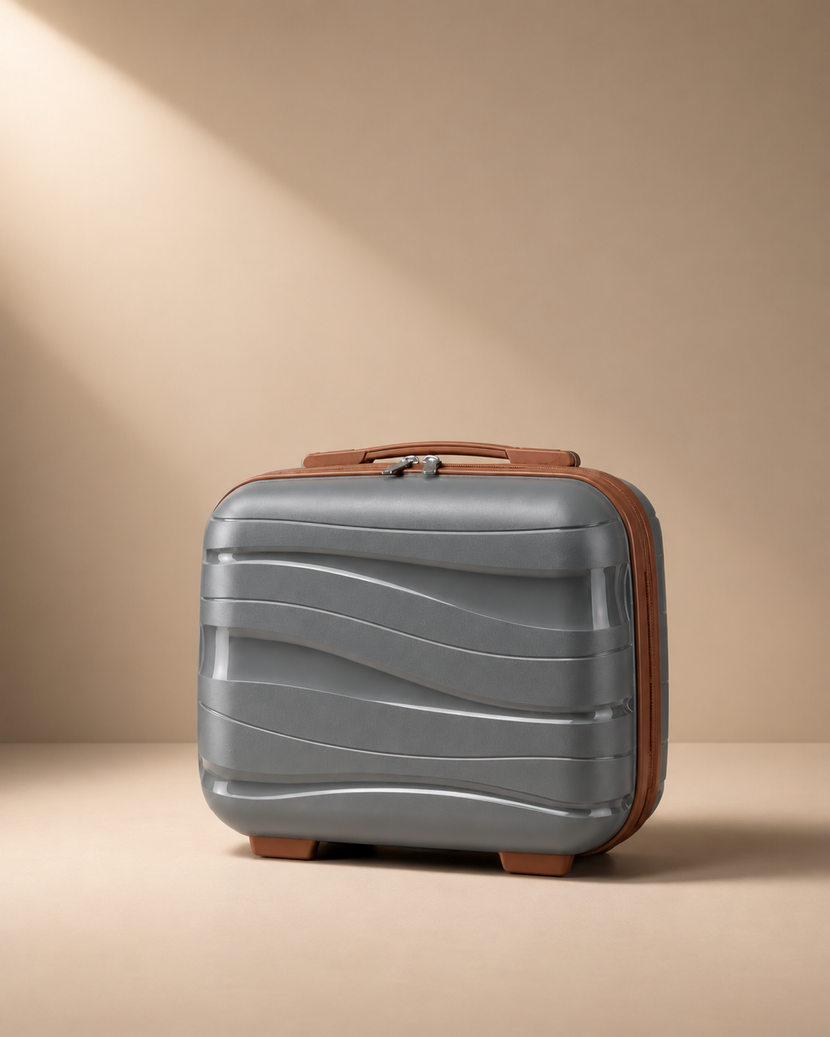 Housel grey hard shell travel makeup case with brown trim, compact shape and premium studio presentation.