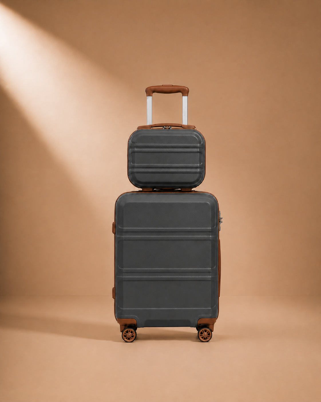 Tenby charcoal and brown two-piece suitcase set — premium studio product view