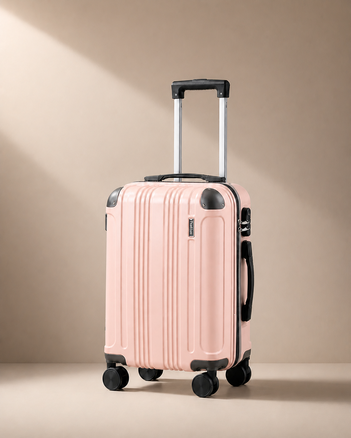 Warkworth pink lightweight 20 inch cabin suitcase with hard shell and smooth spinner wheels