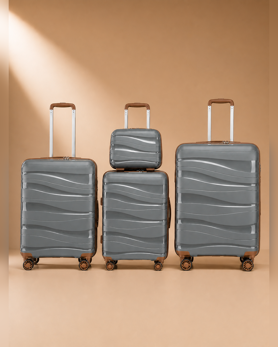 Rhosneigr 4 Piece Hard Shell Suitcase Set - Grey colour variant. Clean premium studio product photography with smooth background and polished hard shell suitcase finish.