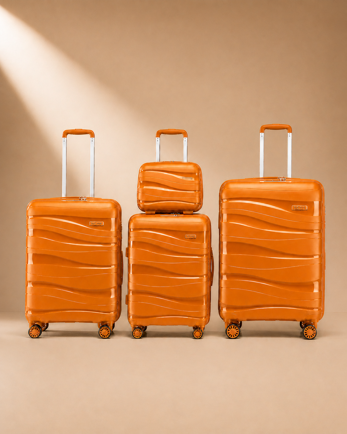 Rhosneigr 4 Piece Hard Shell Suitcase Set - Orange colour variant. Premium studio product photography with clean continuous background and polished hard shell suitcase finish.