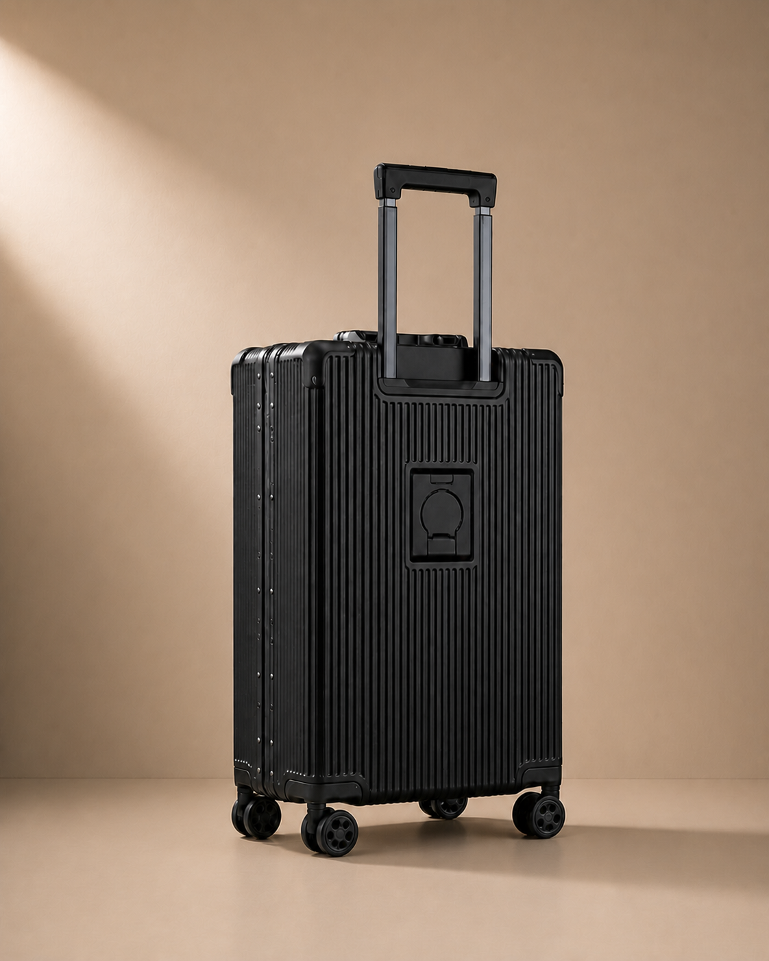 Black ribbed cabin suitcase rear view with trolley handle