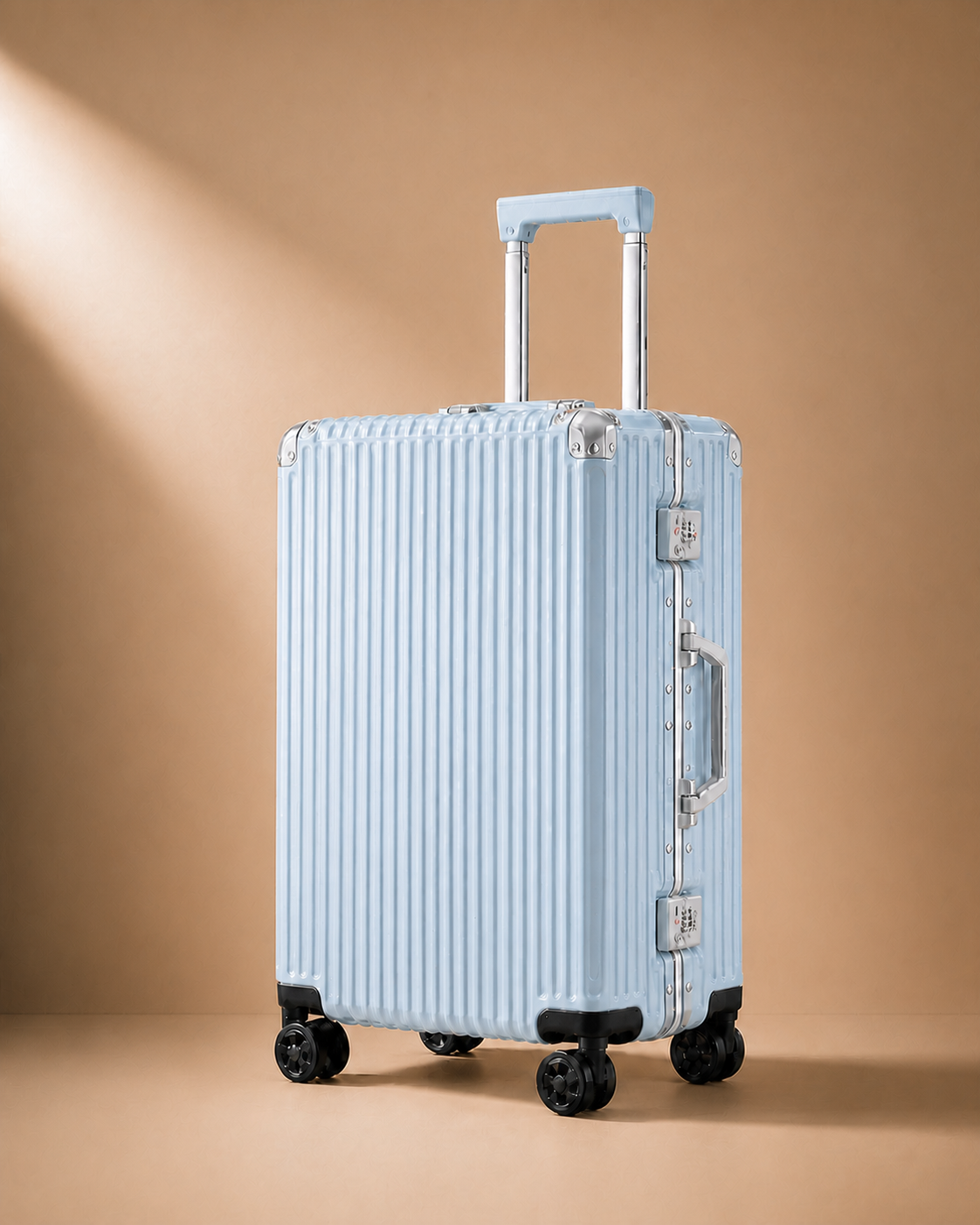 Blue ribbed cabin suitcase with side locks on a warm studio background