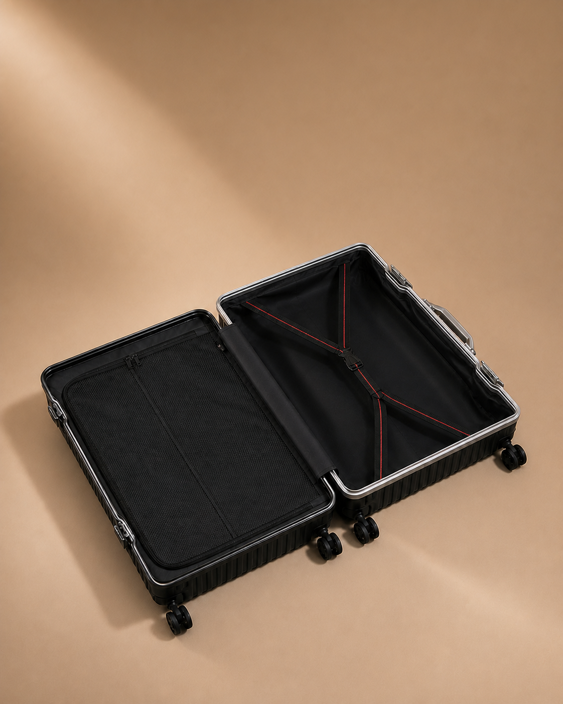 Open black ribbed cabin suitcase showing organised interior compartments