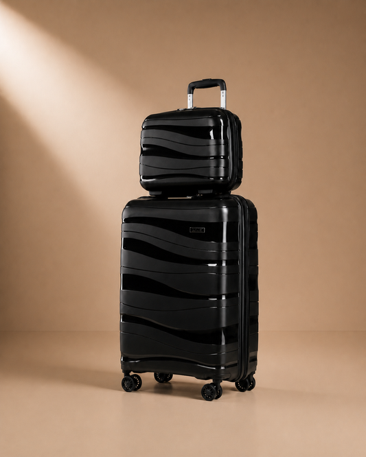 Black hard shell travel makeup case set on a warm studio background