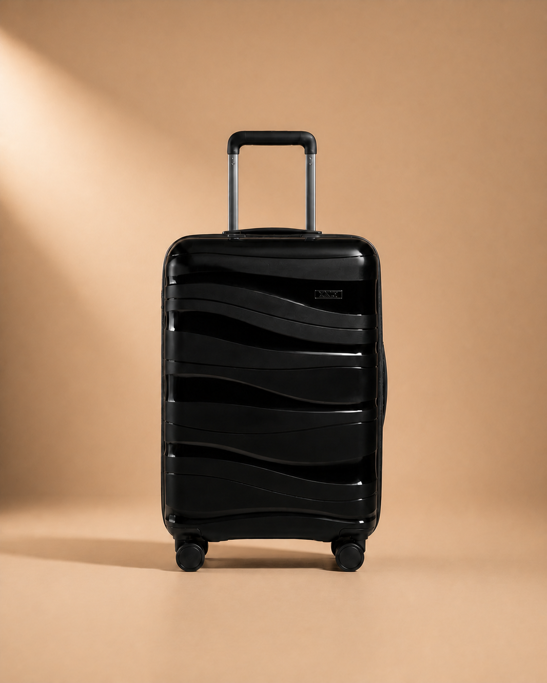 Black hard shell travel makeup case front view with smooth spinner wheels