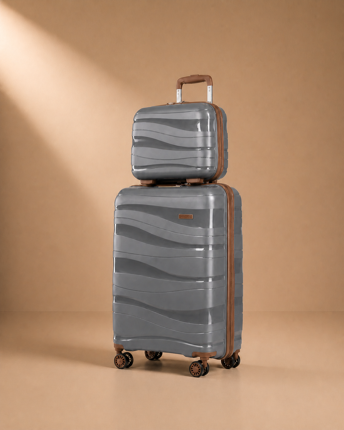 Grey hard shell travel makeup case set on a warm studio background