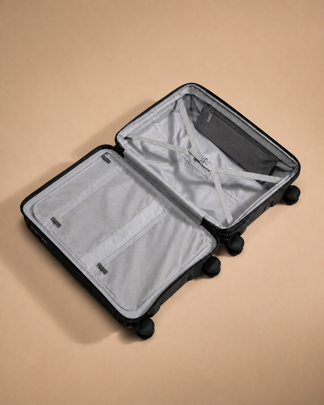 Open hard shell travel makeup case showing the organised interior compartments