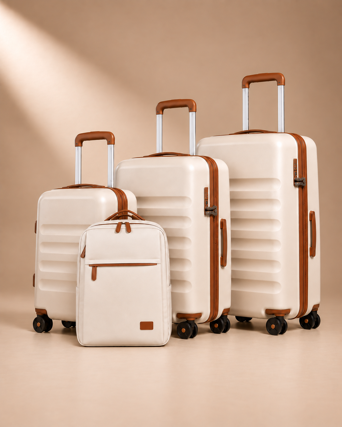 Painswick beige hard-shell suitcase set with three wheeled suitcases and a travel backpack with a front zipped pocket.