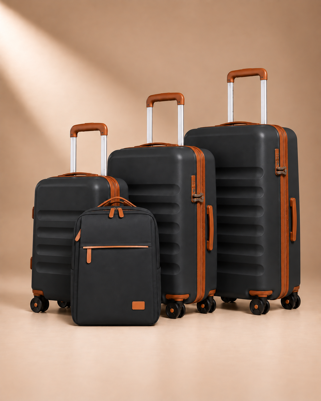 Painswick black hard-shell suitcase set with three wheeled suitcases and a travel backpack with a front zipped pocket.
