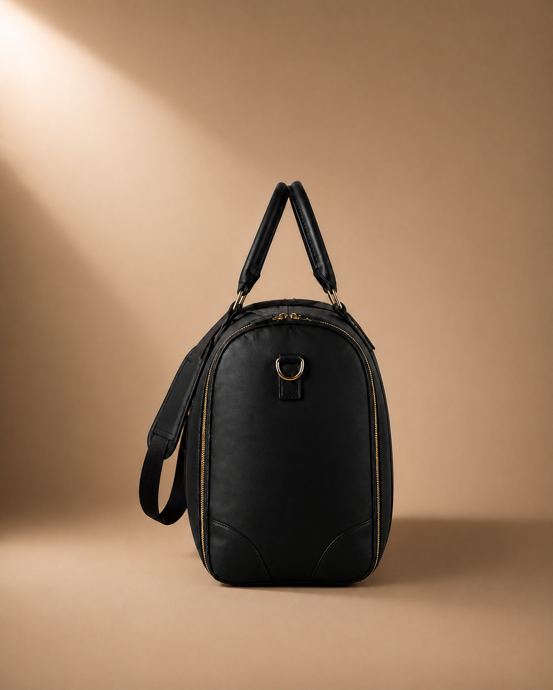 Black garment travel bag side view with gold zip detail